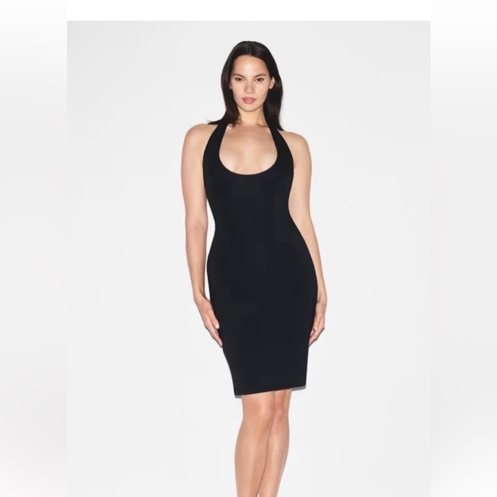 On Skims site for $94. >>>SKIMS Black Backless Dress